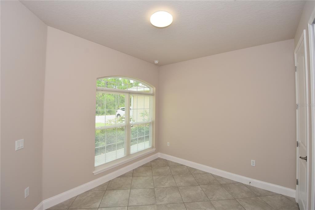 16 Serbian Bellflower Trail, Unit A Palm Coast, FL 32164 - Photo 27 of 41 a view of an empty room with a window