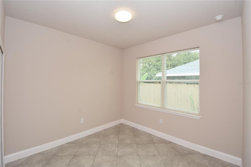 16 Serbian Bellflower Trail, Unit A Palm Coast, FL 32164 - Photo 33 of 41 an empty room with a window