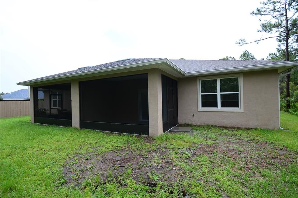 16 Serbian Bellflower Trail, Unit A Palm Coast, FL 32164 - Photo 41 of 41 front view of a house with yard