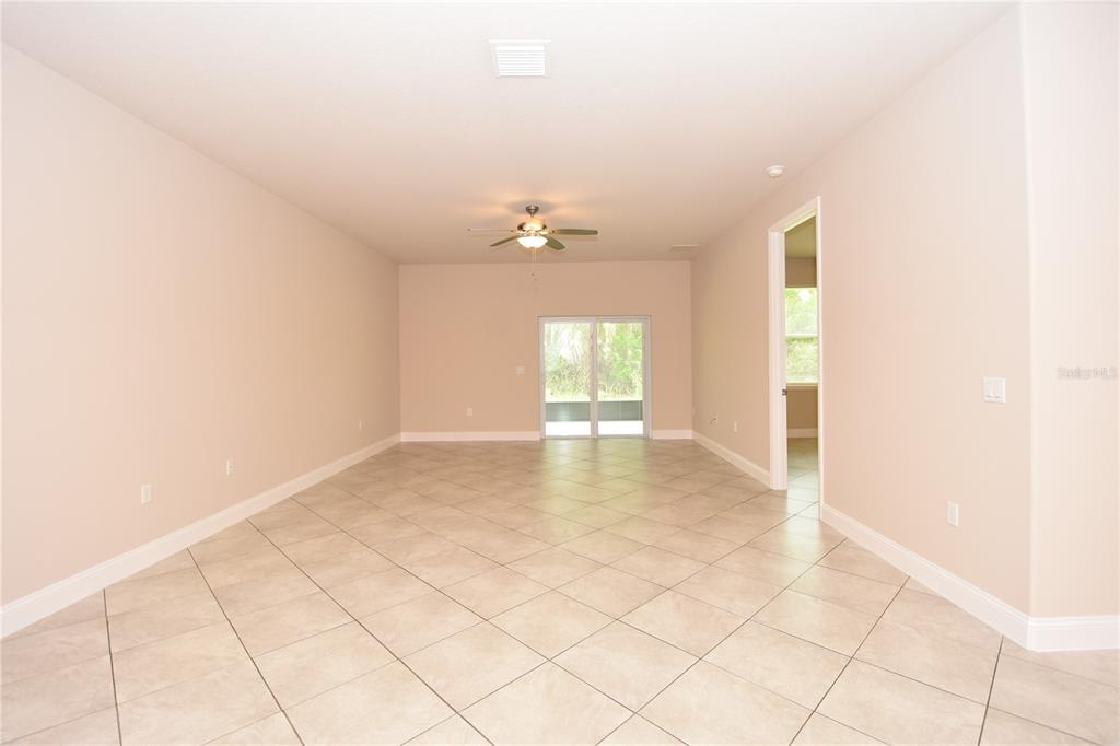 16 Serbian Bellflower Trail, Unit A Palm Coast, FL 32164 - Photo 10 of 41 a view of an empty room with a window
