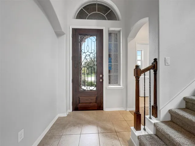 a view of front door with a hallway