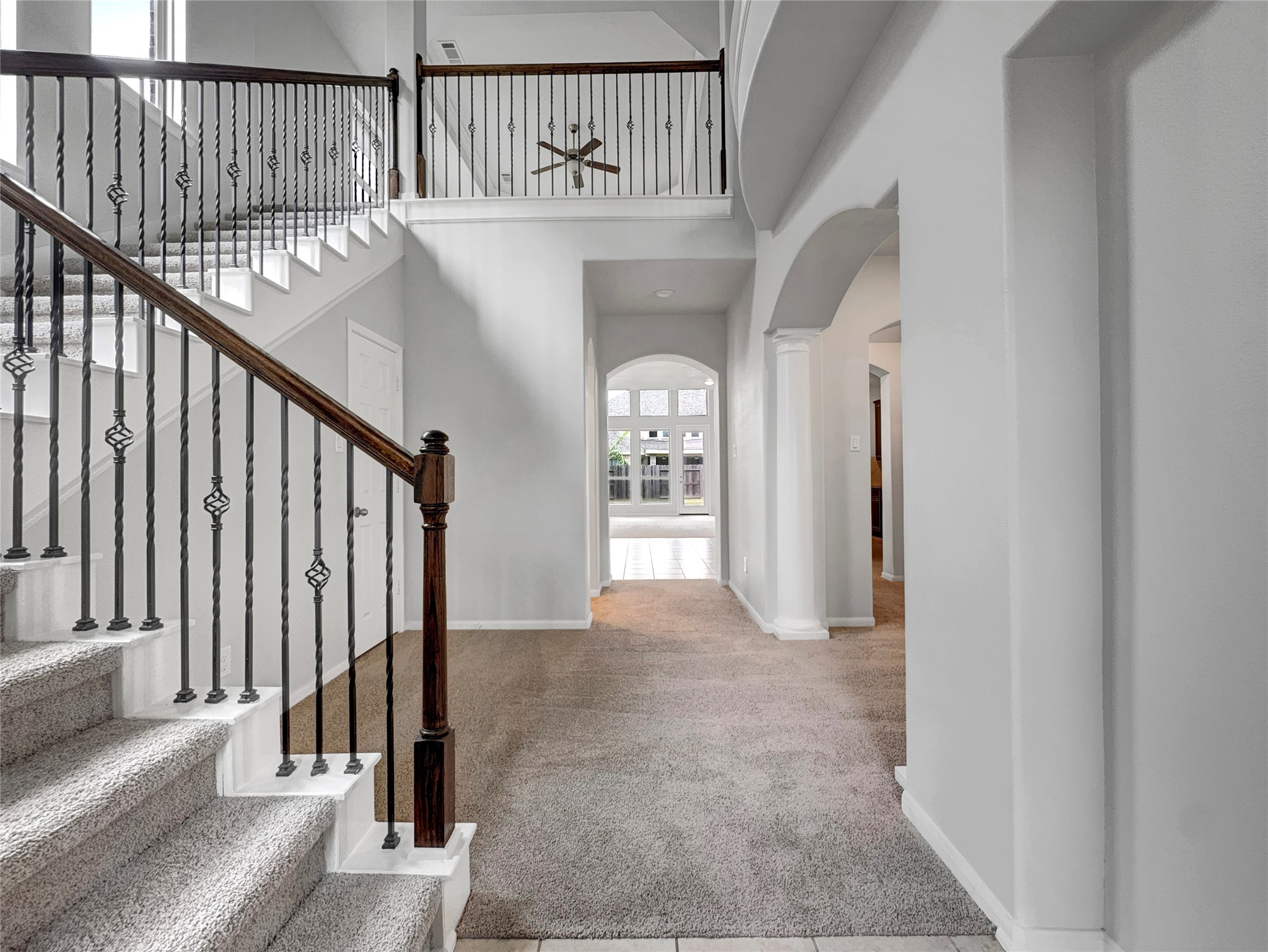 632 Kickapoo Court Webster, TX 77598 - Photo 9 of 23 a view of staircase with railing and white walls