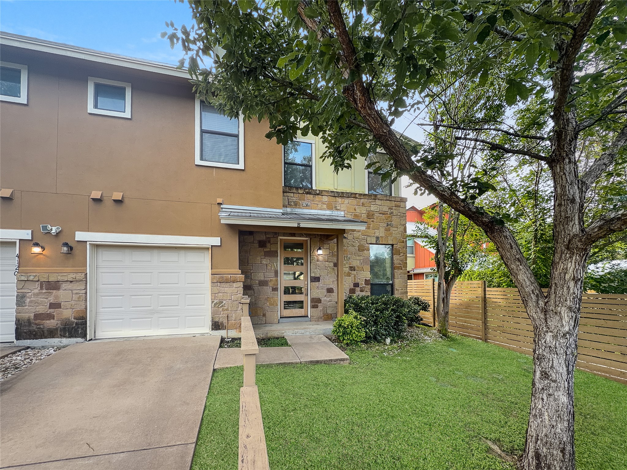 4120 Valley View Road, Unit B Austin, TX 78704 - Photo 1 of 17 A well-maintained lawn and sturdy wooden fence enhance this home's curb appeal.