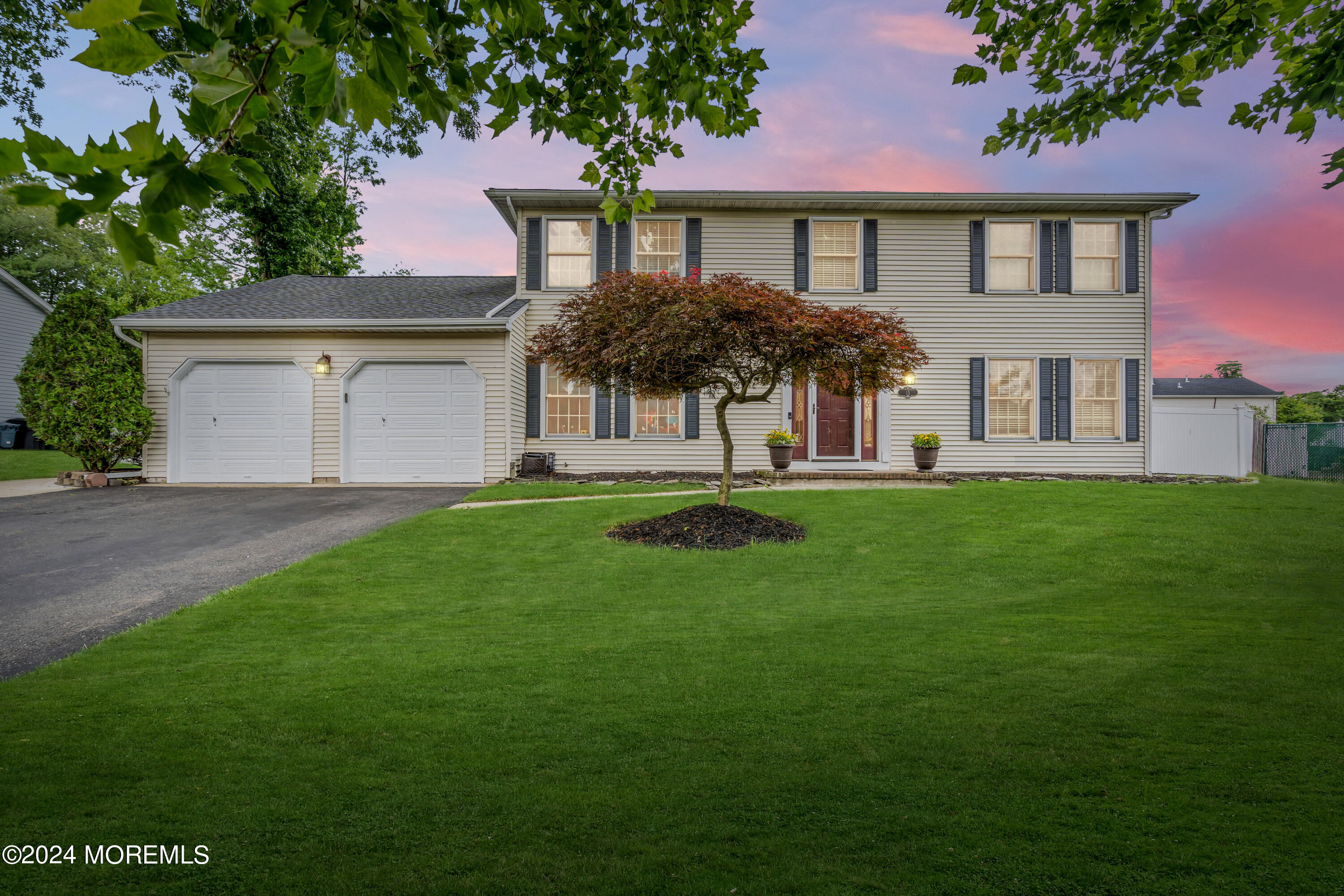 15 Spicy Pond Road Howell, NJ 07731 - Photo 1 of 74 a front view of a house with a garden