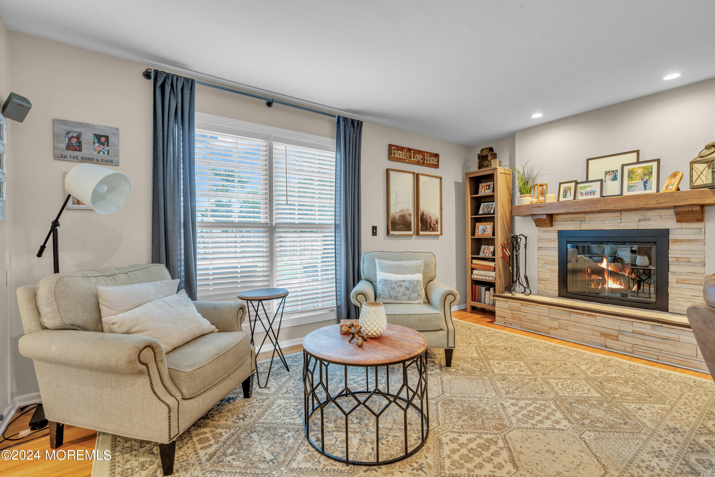 15 Spicy Pond Road Howell, NJ 07731 - Photo 12 of 74 a living room with furniture a window and a fireplace