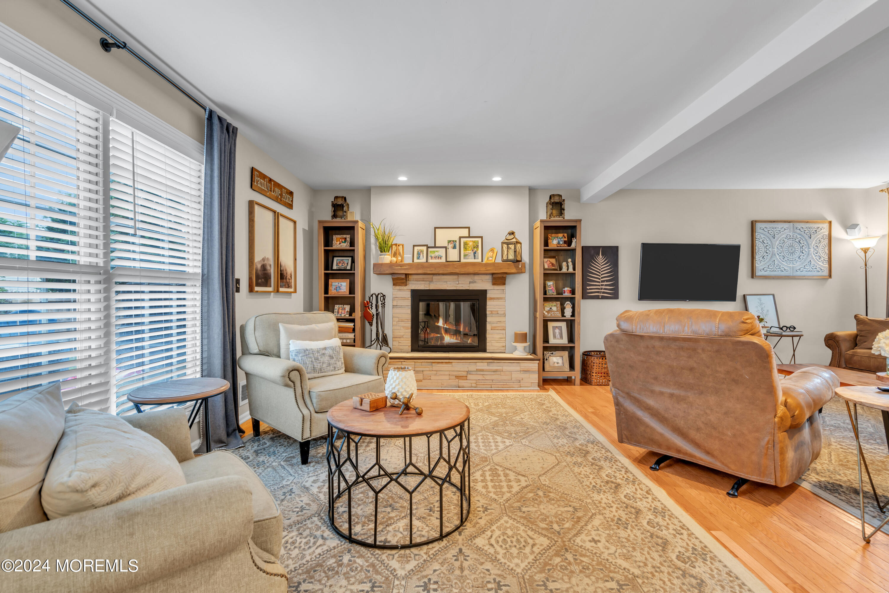 15 Spicy Pond Road Howell, NJ 07731 - Photo 15 of 74 a living room with furniture and a fireplace