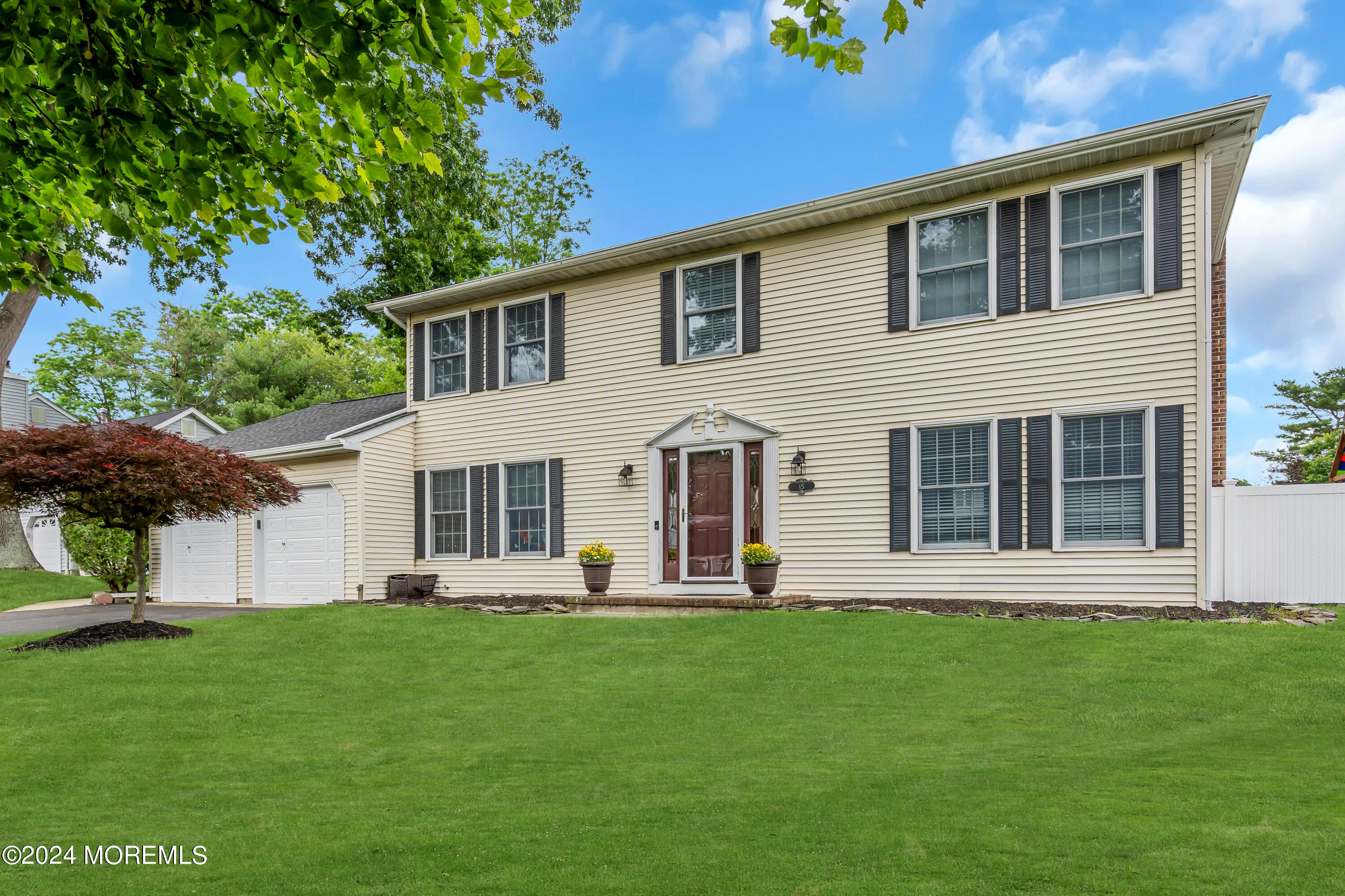 15 Spicy Pond Road Howell, NJ 07731 - Photo 2 of 74 a front view of a house with a garden