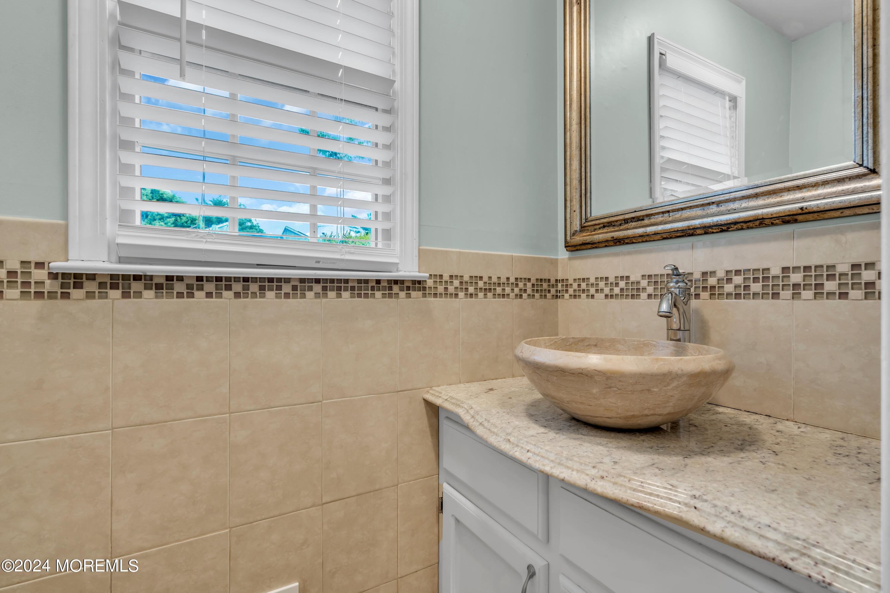 15 Spicy Pond Road Howell, NJ 07731 - Photo 29 of 74 a bathroom with a granite countertop sink and a window