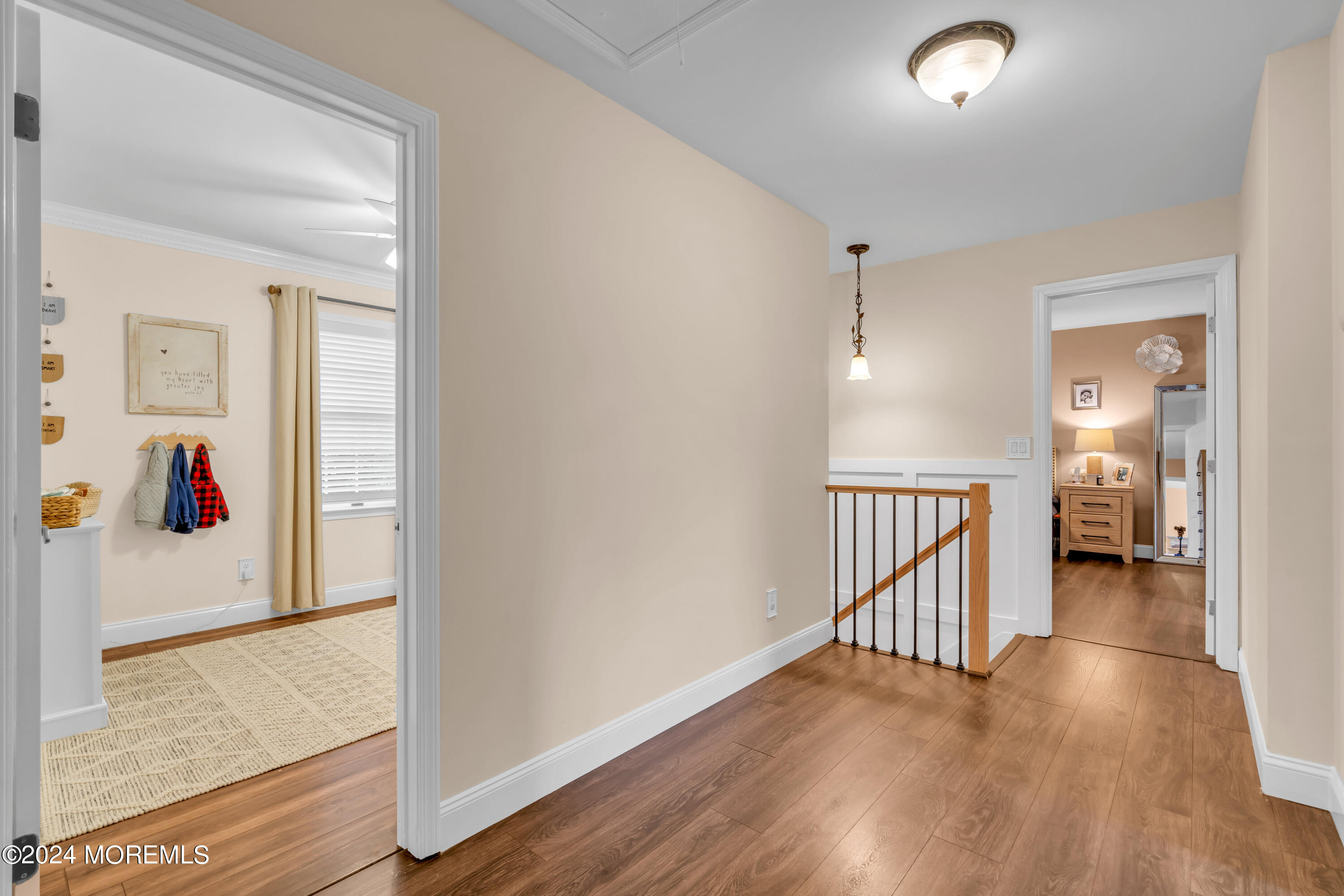 15 Spicy Pond Road Howell, NJ 07731 - Photo 34 of 74 a view of a hallway with wooden floor and a bathroom