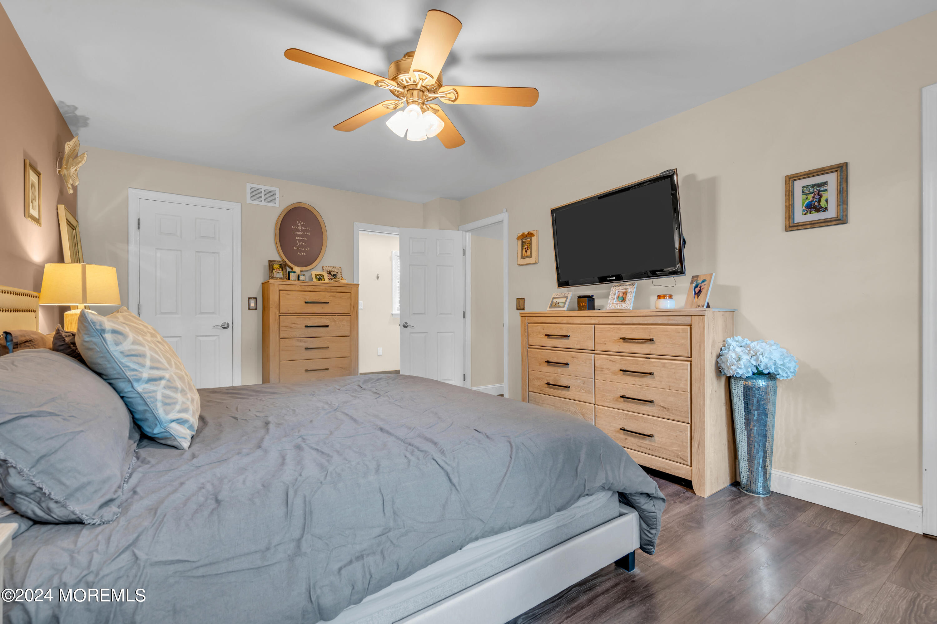 15 Spicy Pond Road Howell, NJ 07731 - Photo 38 of 74 a bedroom with a bed and a flat screen tv