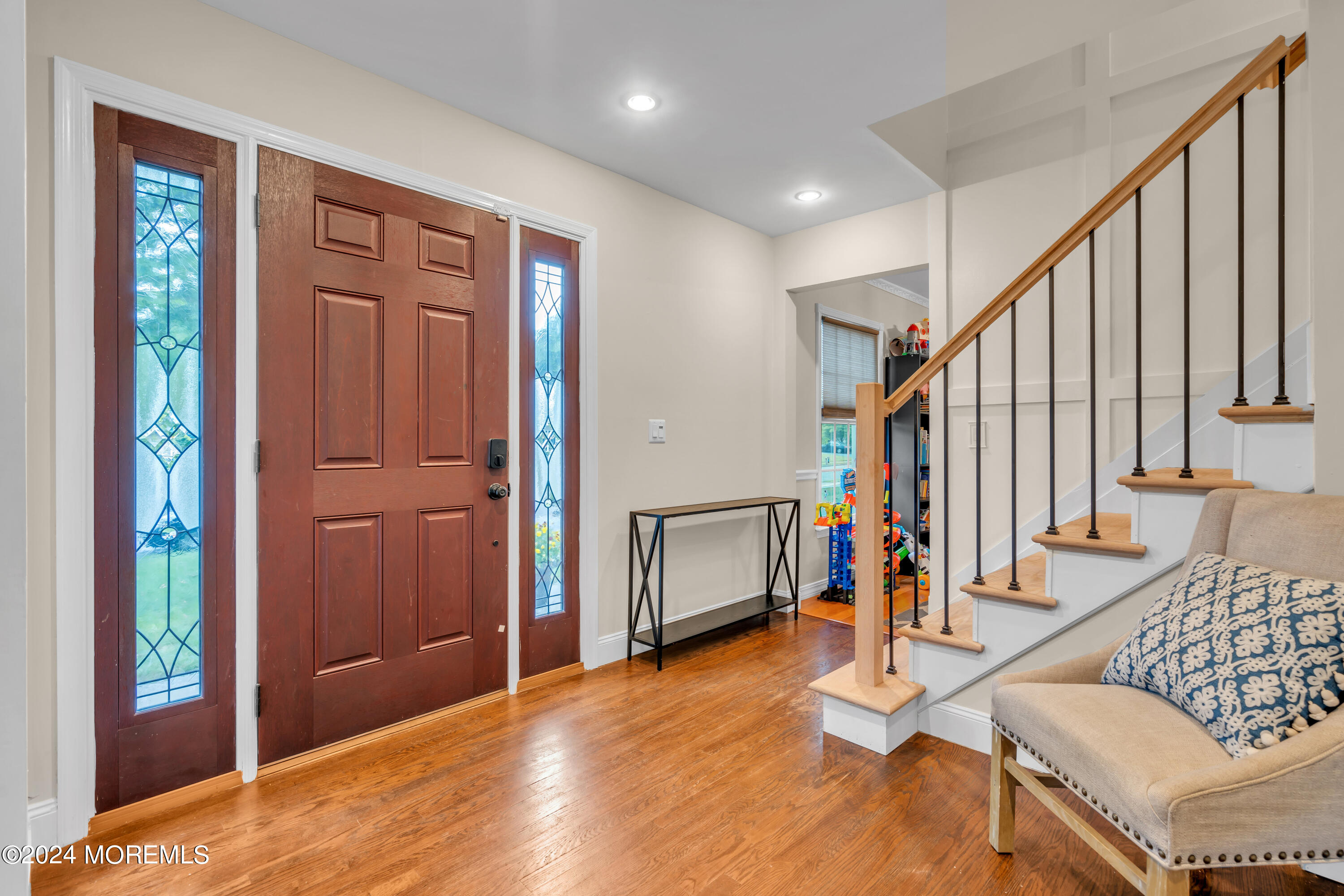 15 Spicy Pond Road Howell, NJ 07731 - Photo 4 of 74 a view of an entryway with wooden floor and stairs