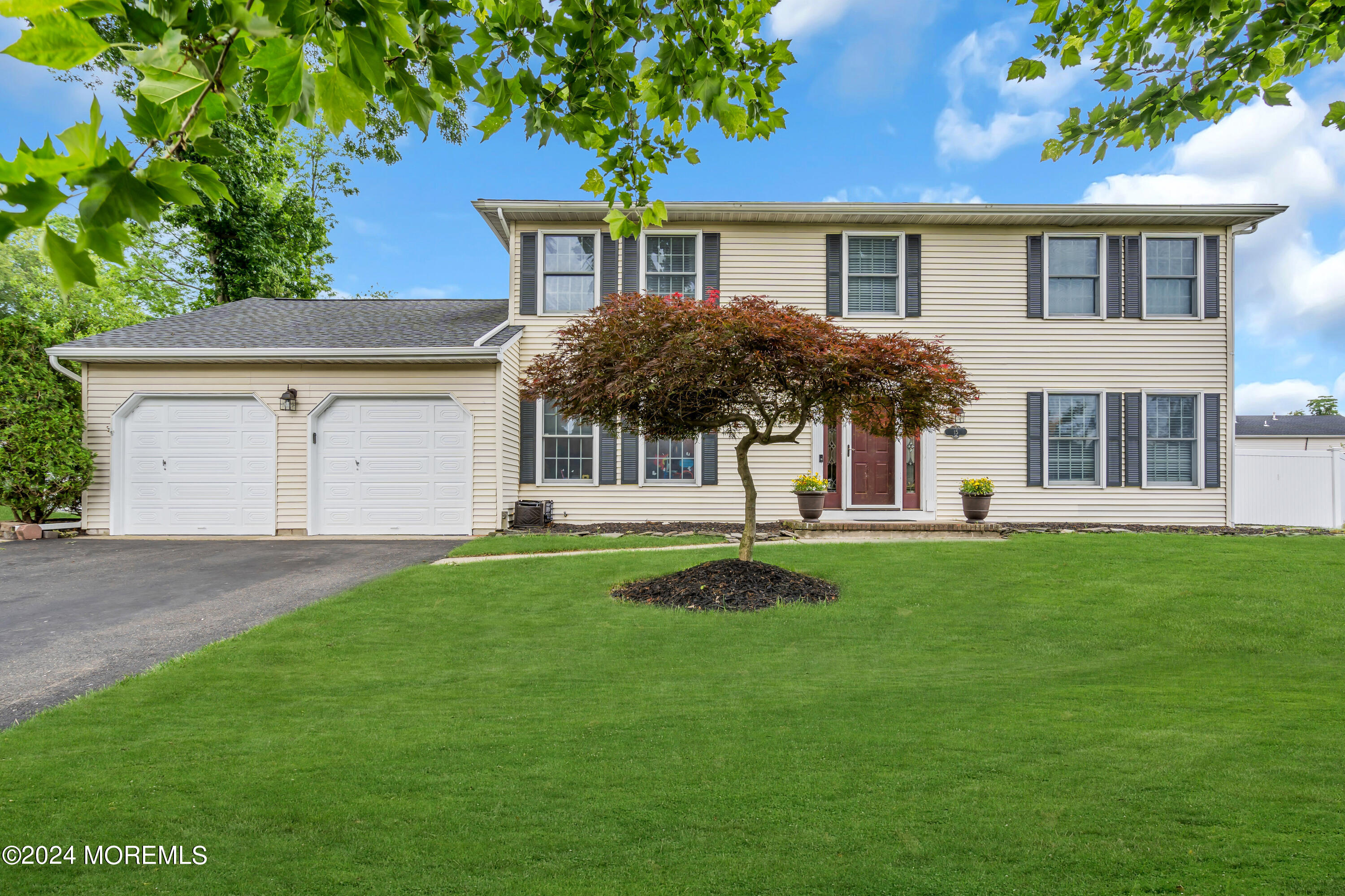 15 Spicy Pond Road Howell, NJ 07731 - Photo 68 of 74 a front view of a house with a garden