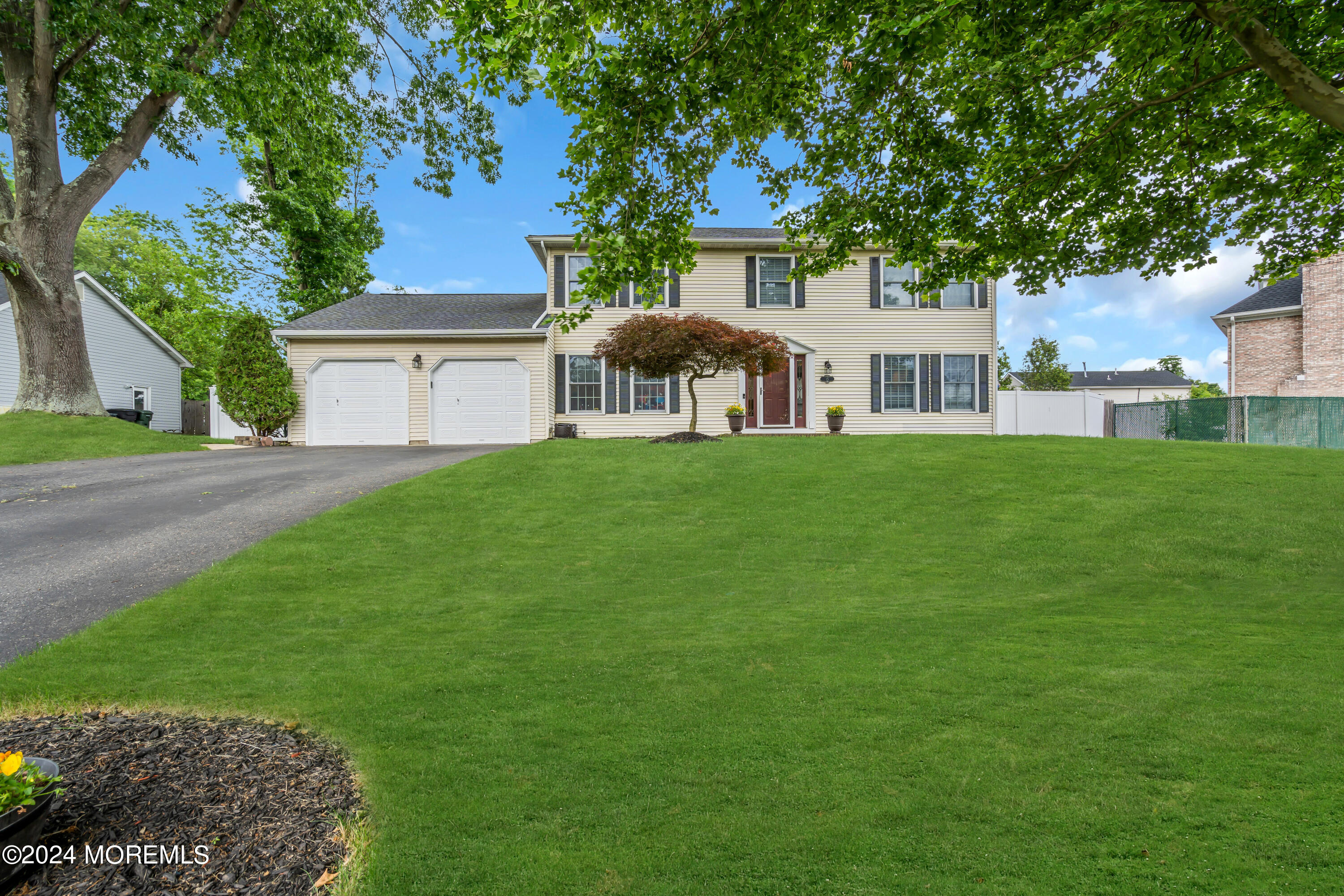 15 Spicy Pond Road Howell, NJ 07731 - Photo 69 of 74 a front view of a house with a garden