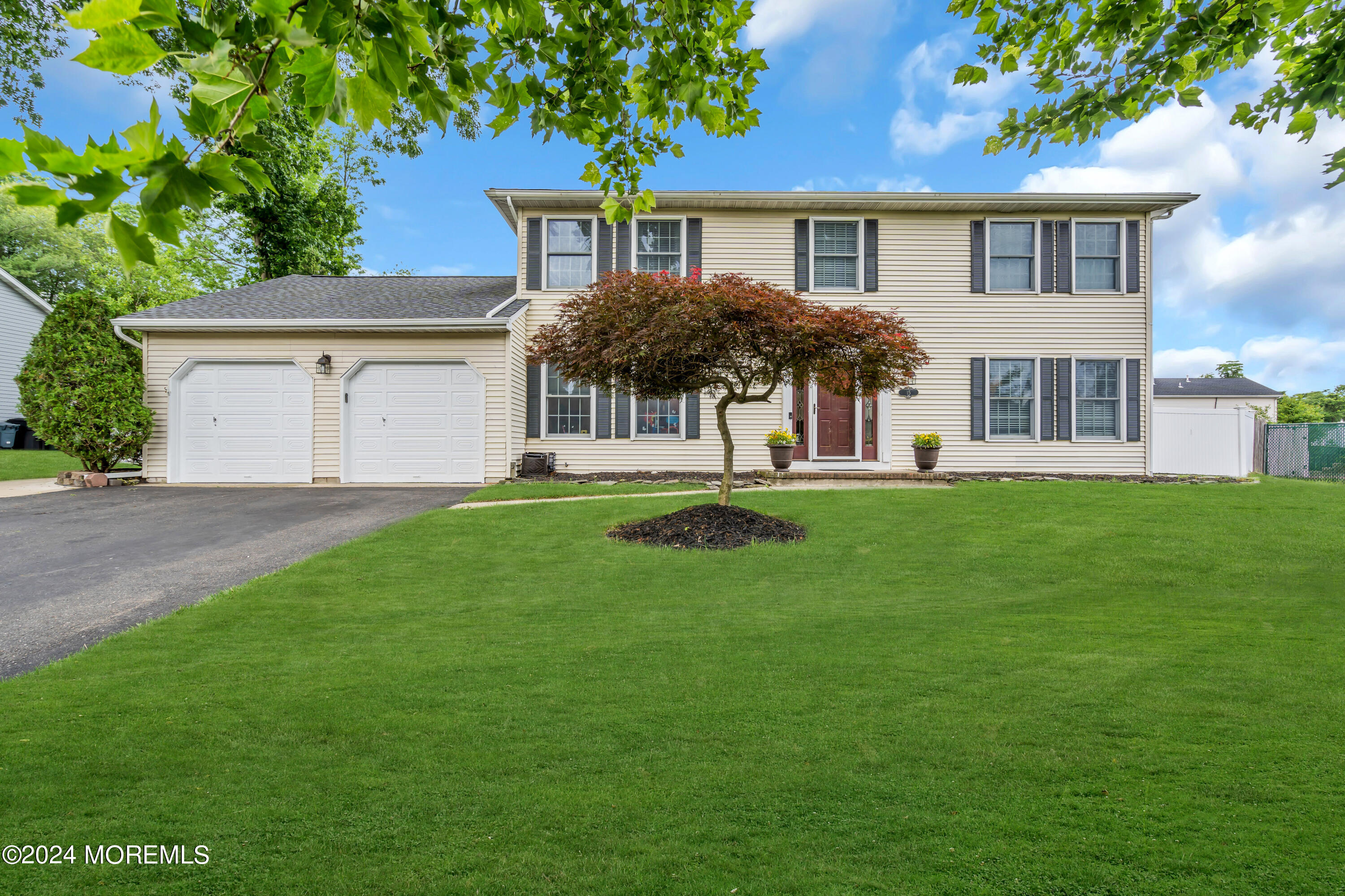 15 Spicy Pond Road Howell, NJ 07731 - Photo 71 of 74 a front view of a house with a garden
