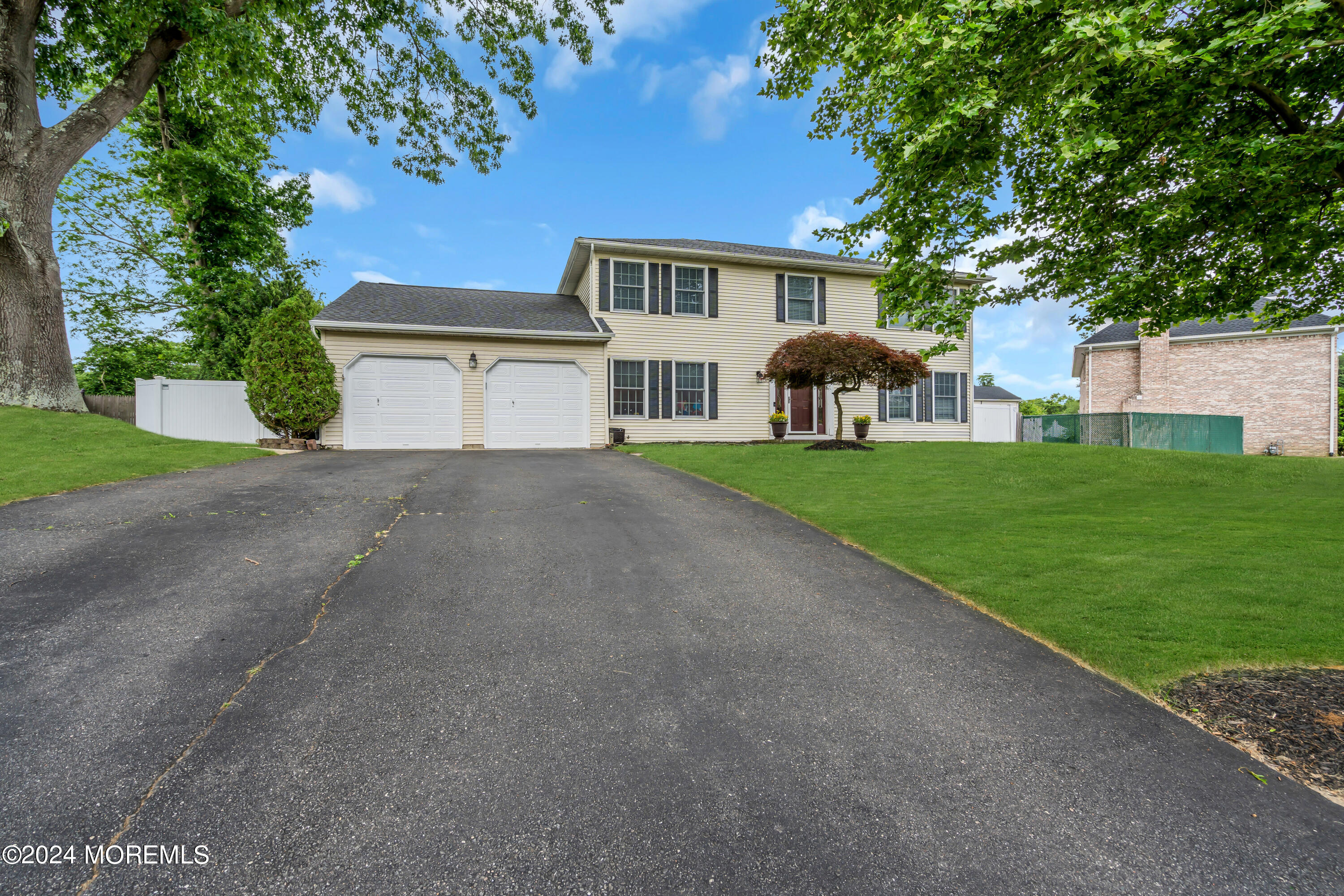 15 Spicy Pond Road Howell, NJ 07731 - Photo 72 of 74 a view of a house with a yard and large tree