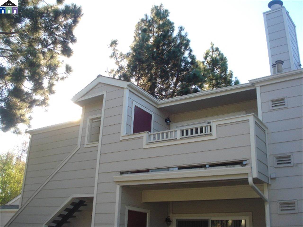 275 Norris Canyon Terrace, Unit D San Ramon, CA 94582 - Photo 1 of 1 a view of a building with a tree