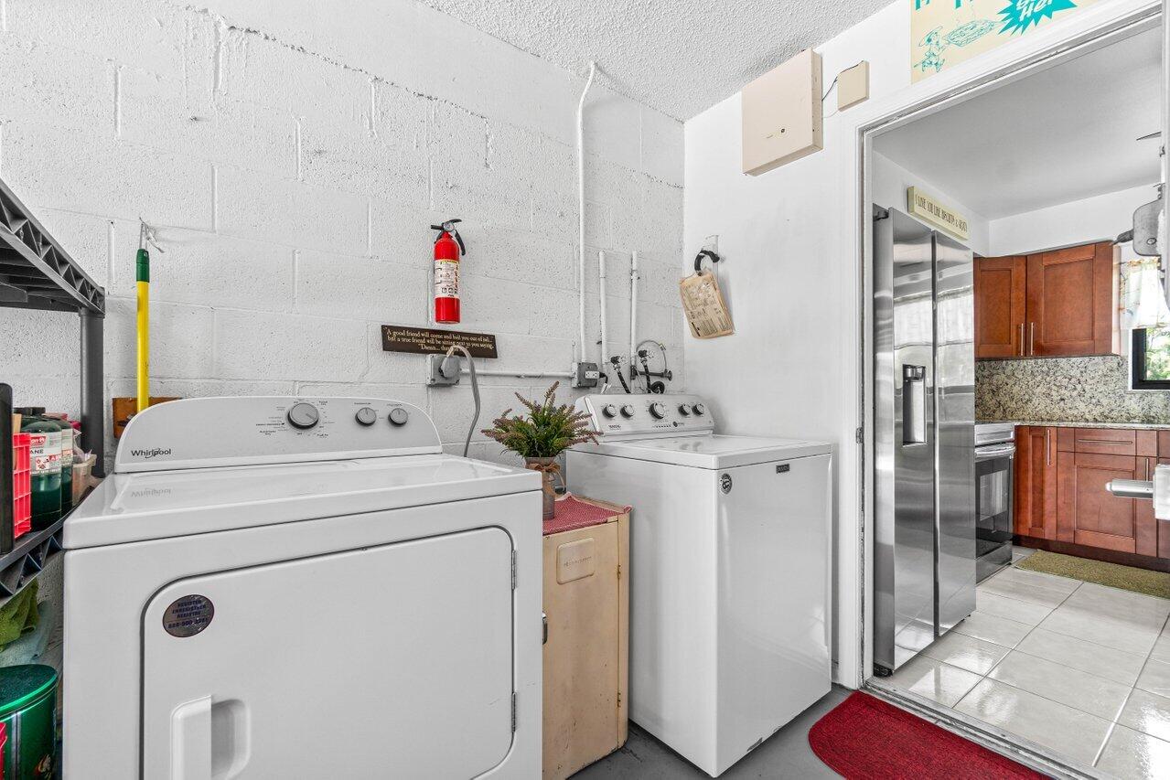 4260 Mango Tree Court, Unit B Boynton Beach, FL 33436 - Photo 19 of 35 a utility room with dryer and washer