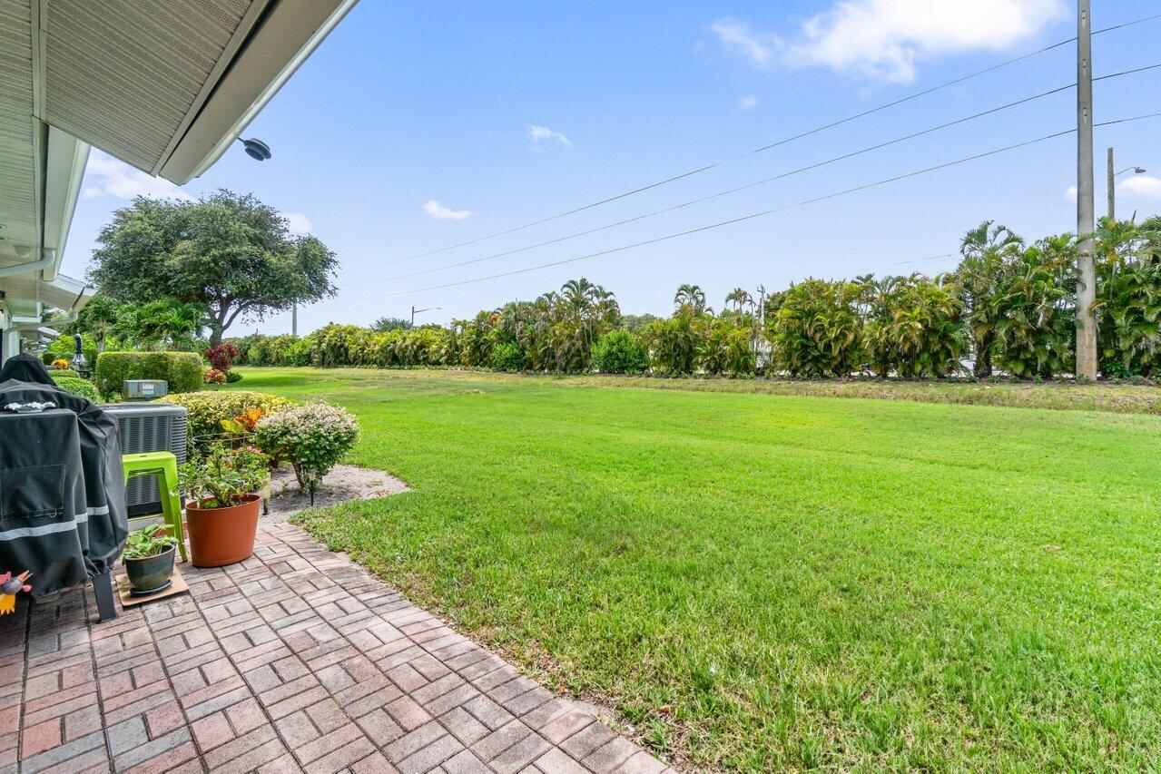 4260 Mango Tree Court, Unit B Boynton Beach, FL 33436 - Photo 22 of 35 a garden view with a seating space
