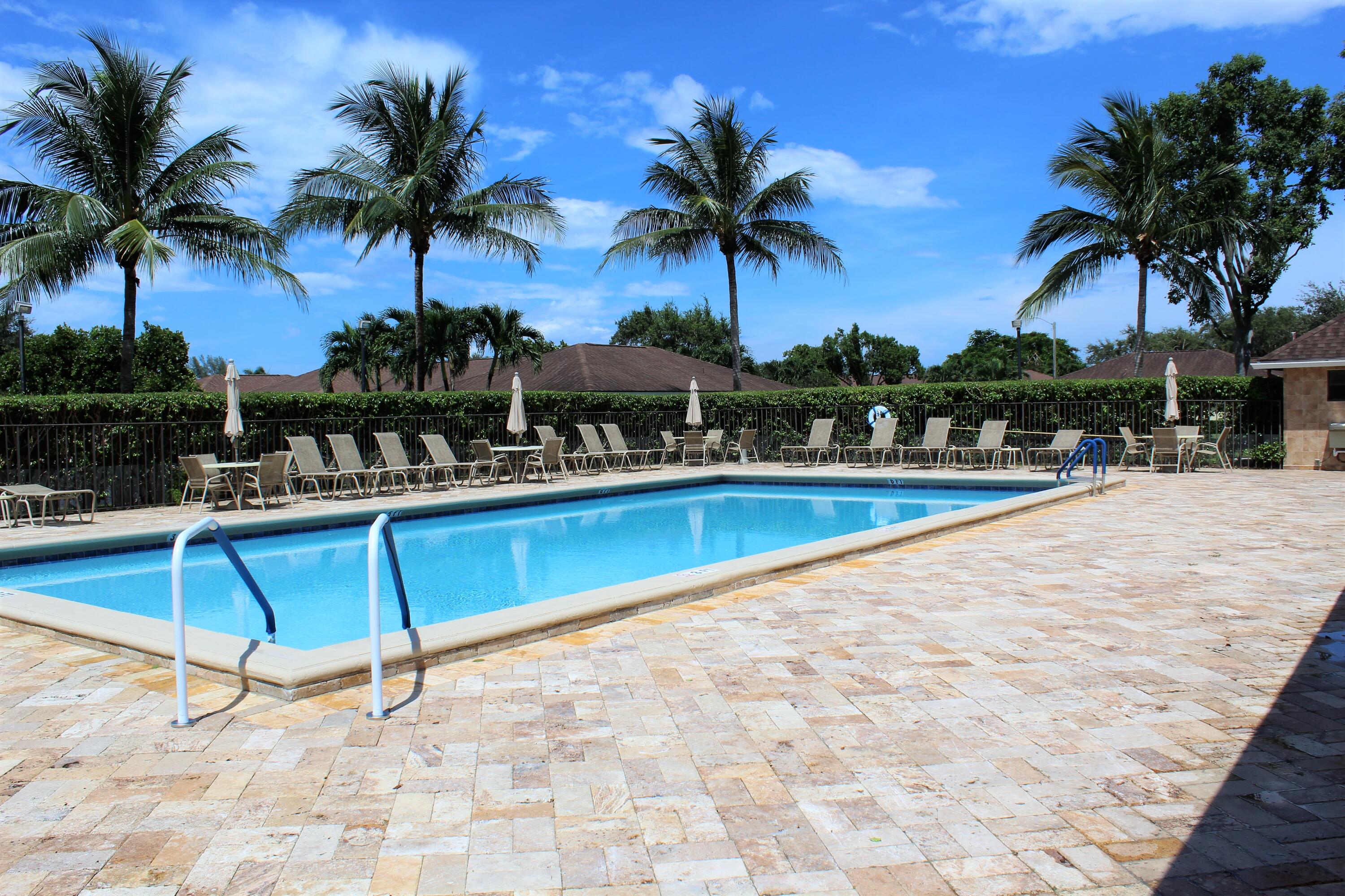 4260 Mango Tree Court, Unit B Boynton Beach, FL 33436 - Photo 33 of 35 a view of outdoor space with trees