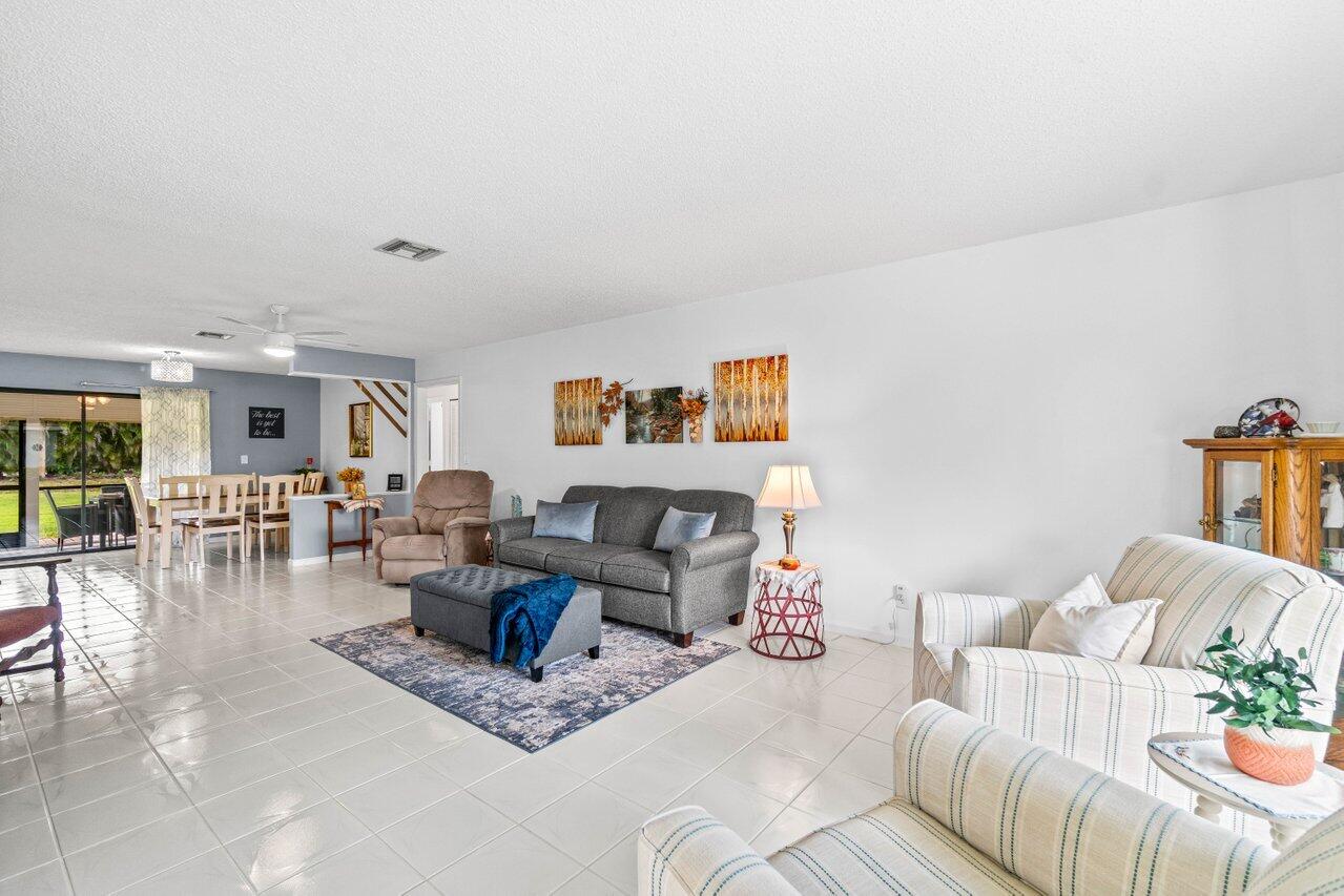 4260 Mango Tree Court, Unit B Boynton Beach, FL 33436 - Photo 5 of 35 a living room with furniture and a table