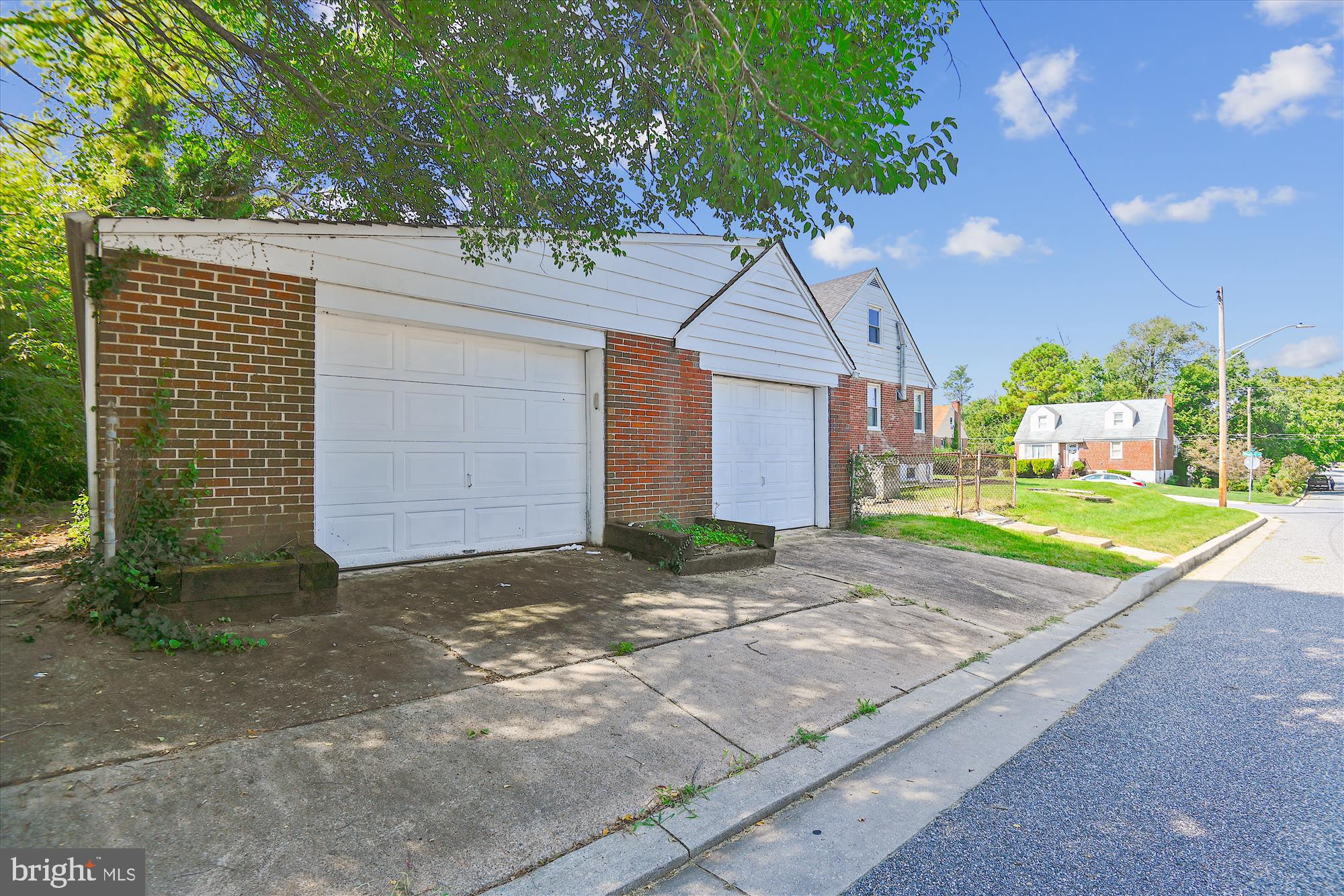 3415 Mayfair Road Gwynn Oak, MD 21207 - Photo 7 of 35 a front view of a house with a yard and garage