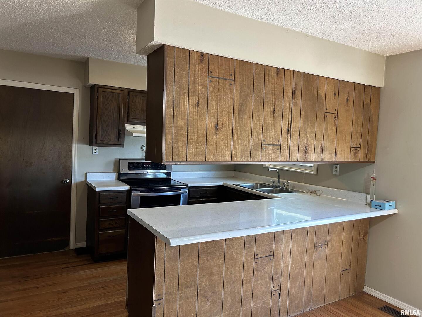 744 Cardinal Road Carbondale, IL 62901 - Photo 6 of 38 a kitchen with a sink and a stove top oven