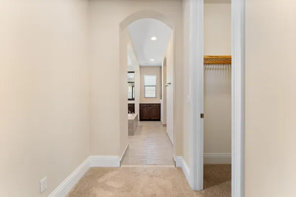 a spacious bathroom with a granite countertop tub sink and mirror