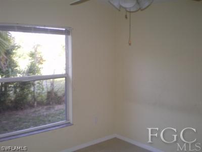 8349 Bahamas Road Fort Myers, FL 33967 - Photo 8 of 10 a view of empty room with windows