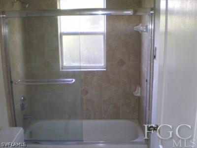 8349 Bahamas Road Fort Myers, FL 33967 - Photo 9 of 10 a bathroom with a bathtub