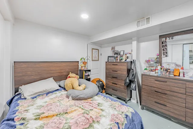 a room with toys and dresser