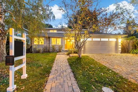 a house with garden in front of it