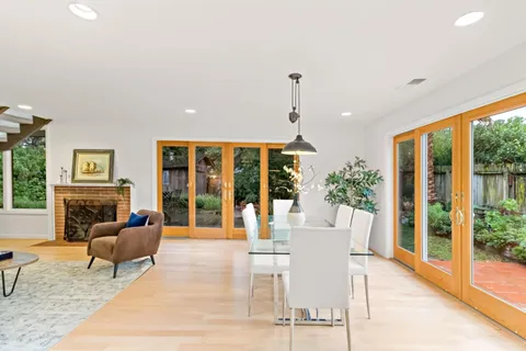 a view of a dining room with furniture window and wooden floor