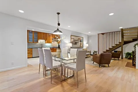 a kitchen with stainless steel appliances granite countertop a refrigerator and a stove top oven