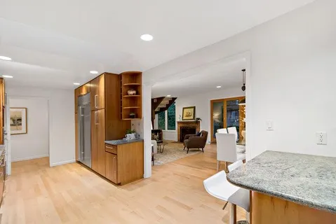 a kitchen with stainless steel appliances a stove microwave and cabinets