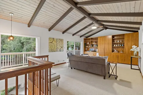 a spacious bedroom with a bed and a large window