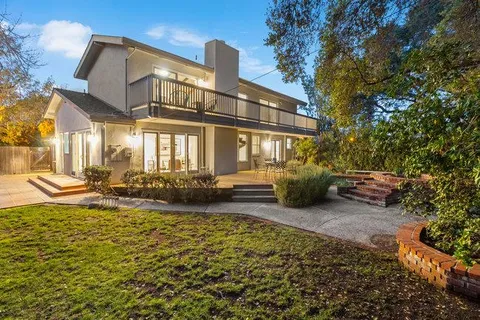 a view of a pathway both side of house