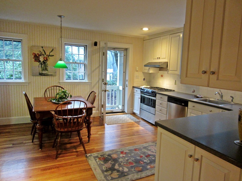 5 Lanark Road Wellesley, MA 02481 - Photo 8 of 18 a kitchen with stainless steel appliances granite countertop a kitchen island a stove a table and chairs