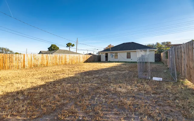 a big house with a big yard and large tree