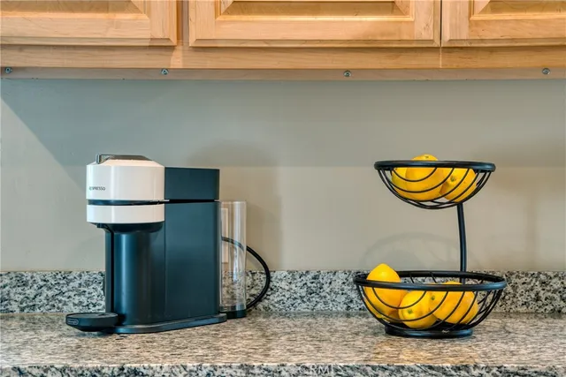 a bedroom with a bed chair and window