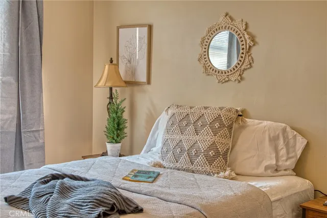 a bathroom with a granite countertop sink a toilet and a shower