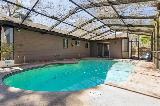 a view of a backyard with a patio and plants
