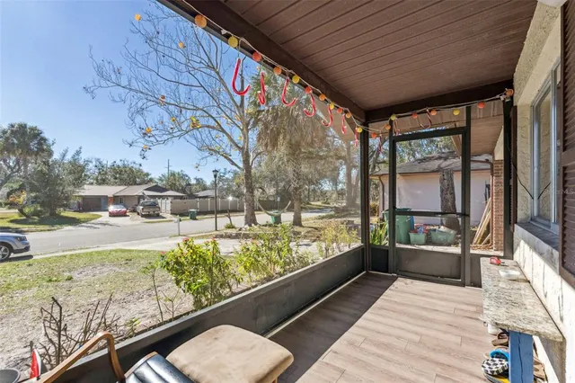 a view of a porch and garden
