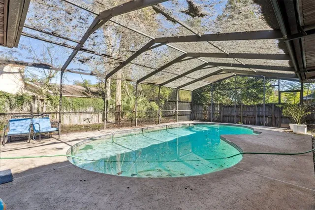 a view of a swimming pool with a patio