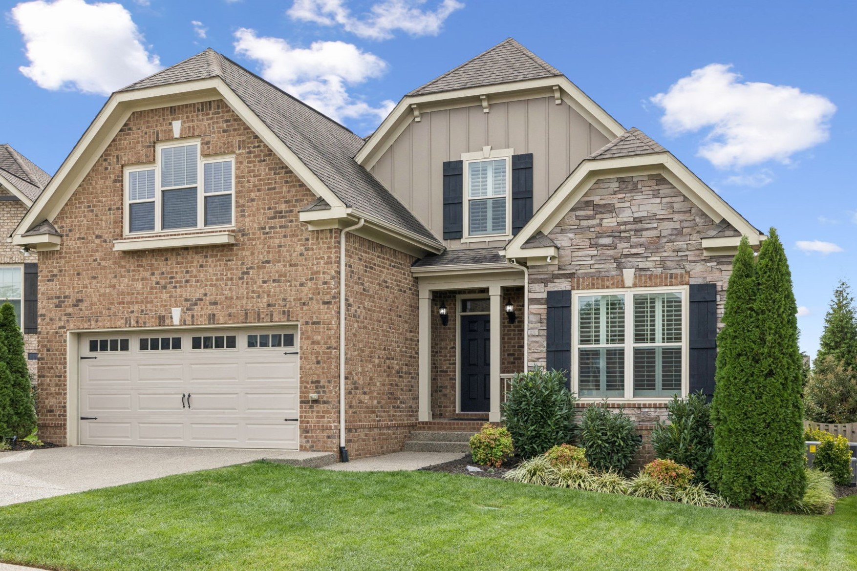 a front view of a house with a yard