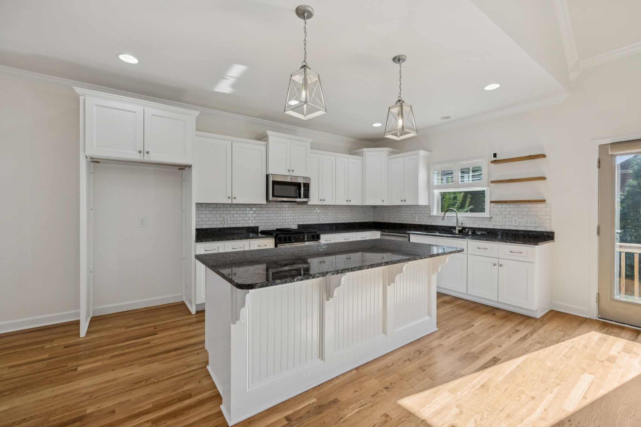 2002 Virgle Circle Spring Hill, TN 37174 - Photo 13 of 44 a kitchen with stainless steel appliances granite countertop a sink and a stove