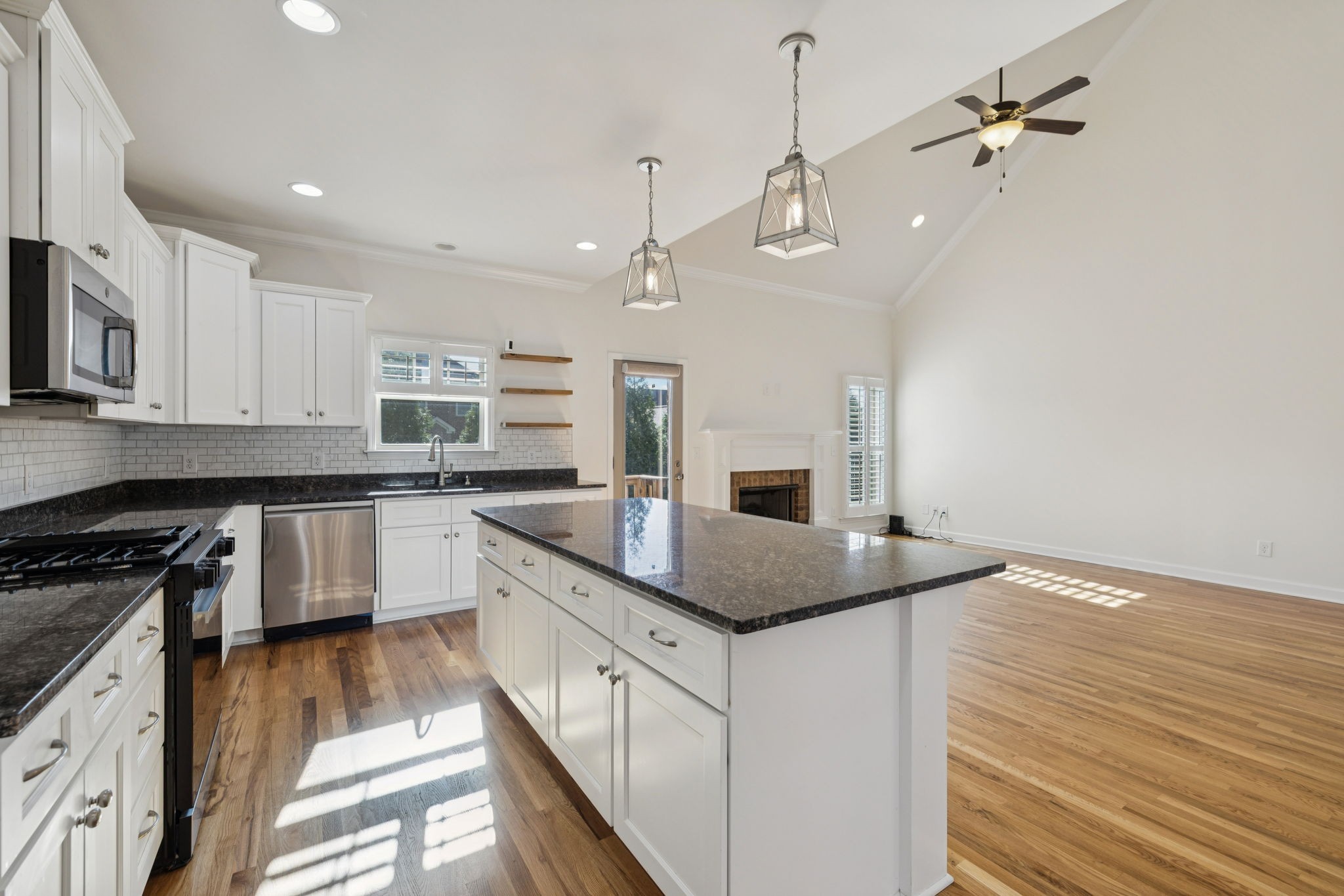 2002 Virgle Circle Spring Hill, TN 37174 - Photo 14 of 44 a kitchen with stainless steel appliances granite countertop a sink a stove top oven a counter space and cabinets