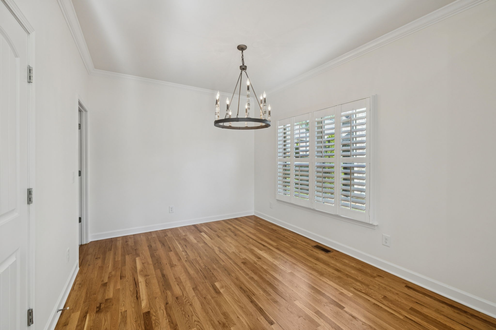 2002 Virgle Circle Spring Hill, TN 37174 - Photo 16 of 44 a view of an empty room with wooden floor and a window