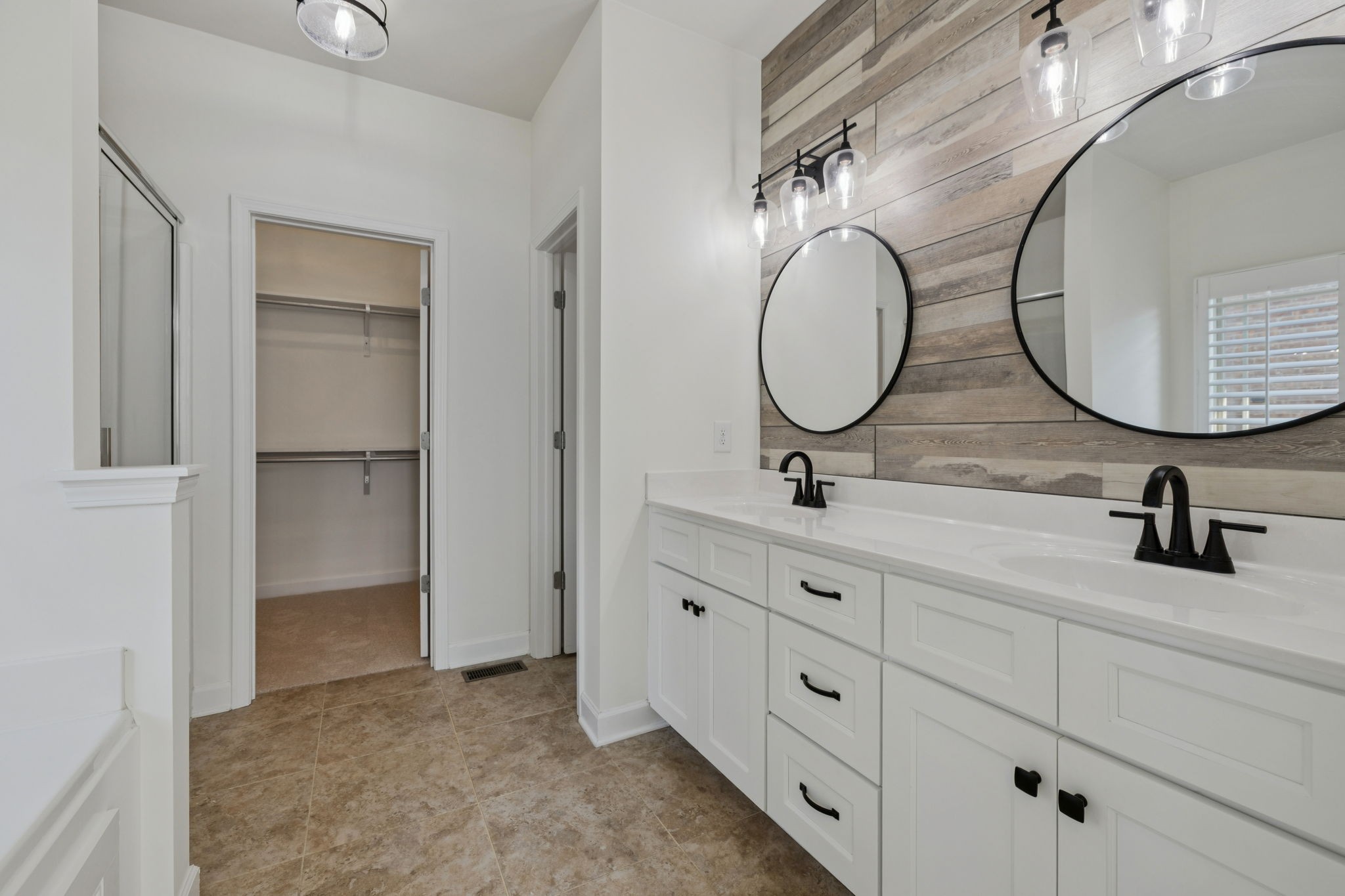 2002 Virgle Circle Spring Hill, TN 37174 - Photo 20 of 44 a bathroom with a double vanity sink and a mirror