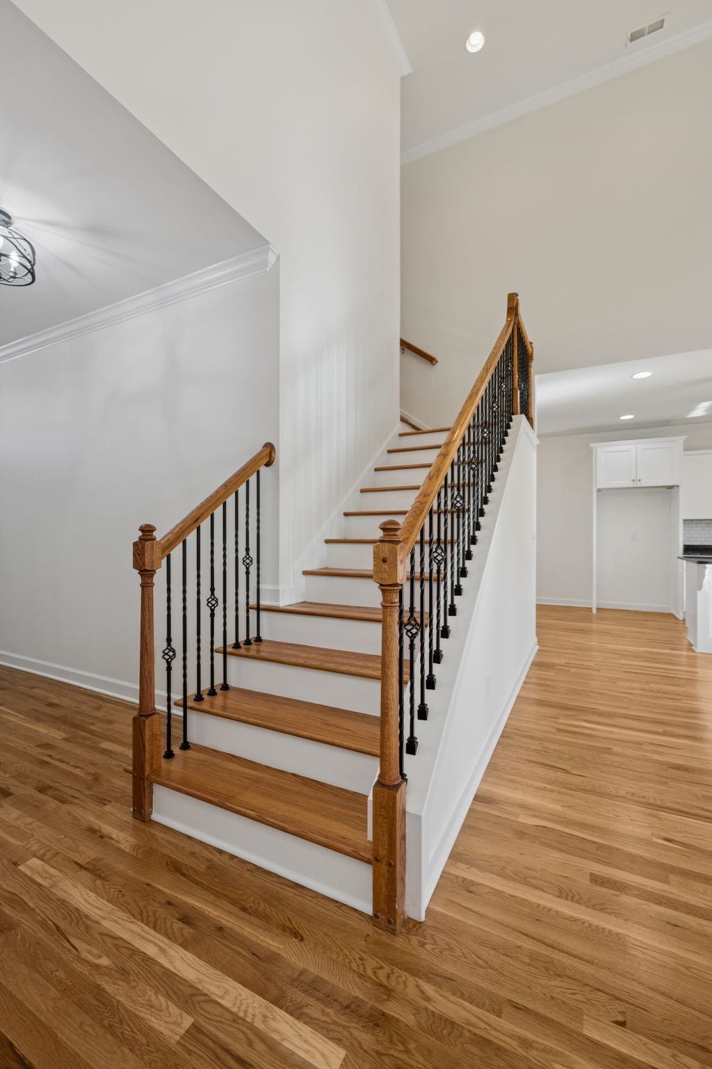 2002 Virgle Circle Spring Hill, TN 37174 - Photo 24 of 44 a view of staircase with wooden floor and white walls