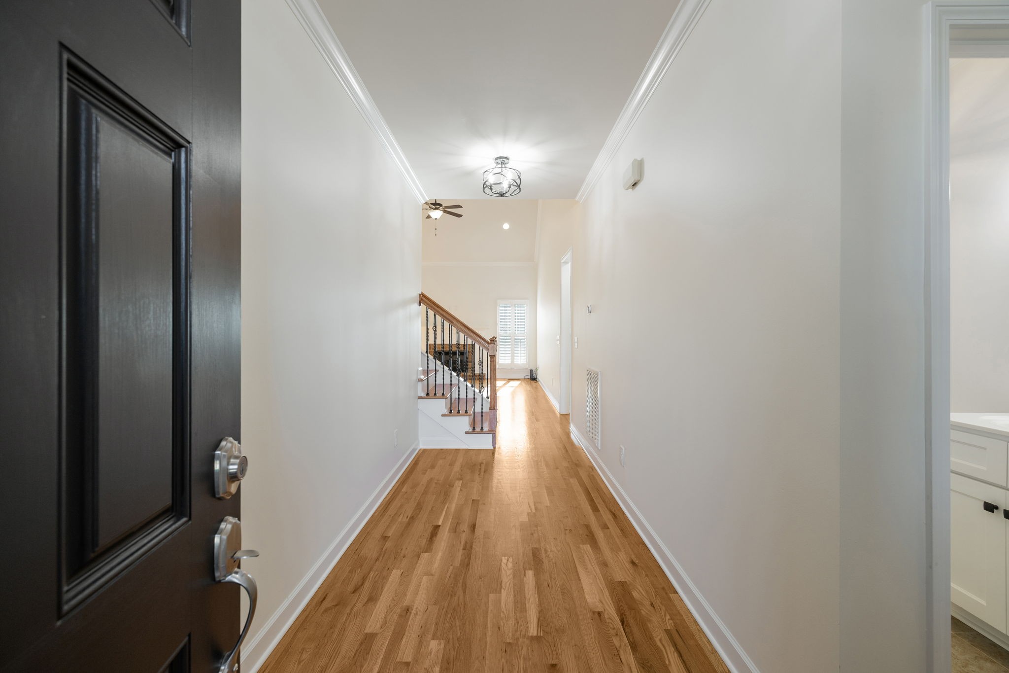 2002 Virgle Circle Spring Hill, TN 37174 - Photo 3 of 44 a view of a hallway with wooden floor and staircase